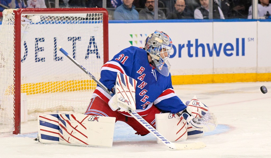 Igor Shesterkin makes one of his 22 saves during the Rangers' victory.