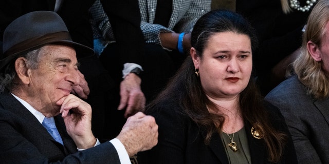 Oksana Markarova, Ukrainian ambassador to the U.S., right, and Paul Pelosi, husband of Rep. Nancy Pelosi, D-Calif., are seen as Markarova is recognized during President Biden's State of the Union address in the House Chamber of the U.S. Capitol on Feb. 7, 2023.    