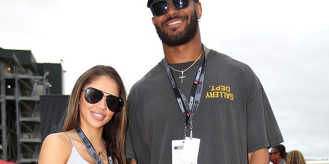 Fred Warner, linebacker for the San Francisco 49ers, and Sydney Warner pose for photos on the red carpet prior to the NASCAR Cup Series Toyota/Save Mart 350 at Sonoma Raceway on June 12, 2022 in Sonoma, California.