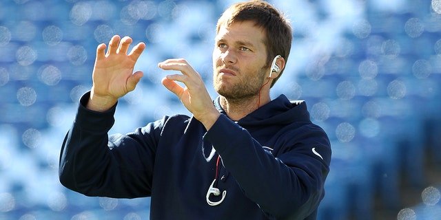 Tom Brady, #12 of the New England Patriots, warms up before the first half against the Buffalo Bills at Ralph Wilson Stadium on Oct. 12, 2014 in Orchard Park, New York.
