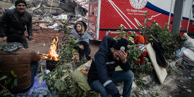 People wait for news of their loved ones on Wednesday, Feb. 8, believed to be trapped under a collapsed building in Hatay, Turkey.