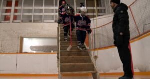 Players descend stairs at Lang’s hockey rink to skate on some of Sask.’s oldest ice